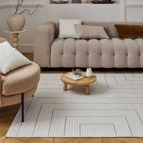 Elegant Geometric Rug in neutral tones enhancing a modern living room with stylish furniture