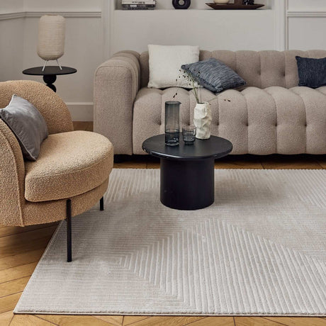 Modern living room featuring a Geometric Rug with a neutral tone under a stylish coffee table