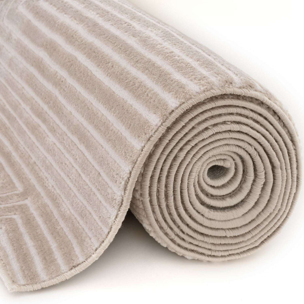 Soft and plush geometric rug with a rolled design in neutral tones for modern interiors