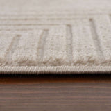 Close-up of a textured Geometric Rug with subtle patterns and a soft beige colour