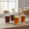 Orsina Glass Mugs set with hot chocolate and herbal tea, perfect for warming beverages