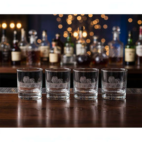 Set of four Selbrae House glass tumblers with intricate lion design, perfect for entertaining guests