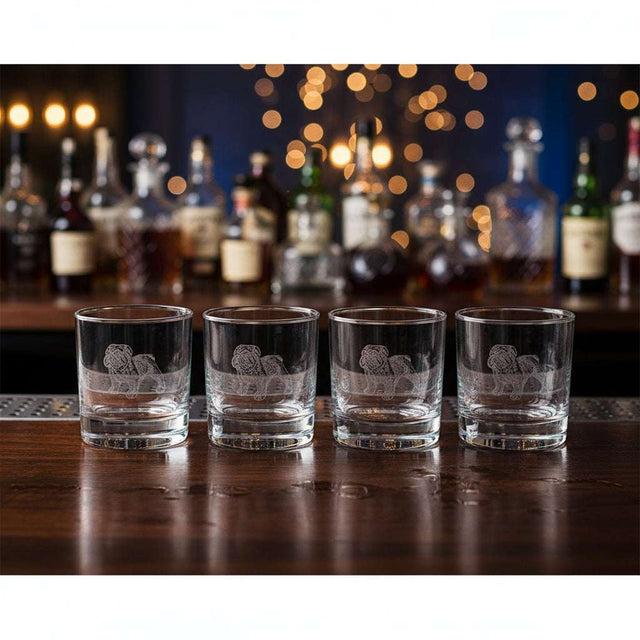 Set of four Selbrae House glass tumblers with intricate lion design, perfect for entertaining guests