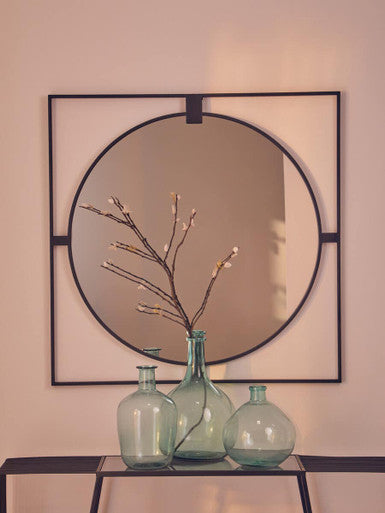 Orsina Glass Vase Trio in Green with Decorative Stems Against a Wall Mirror