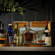 Selbrae House Golf Decanter and glass set with elegant whisky and bottles in a stylish setting