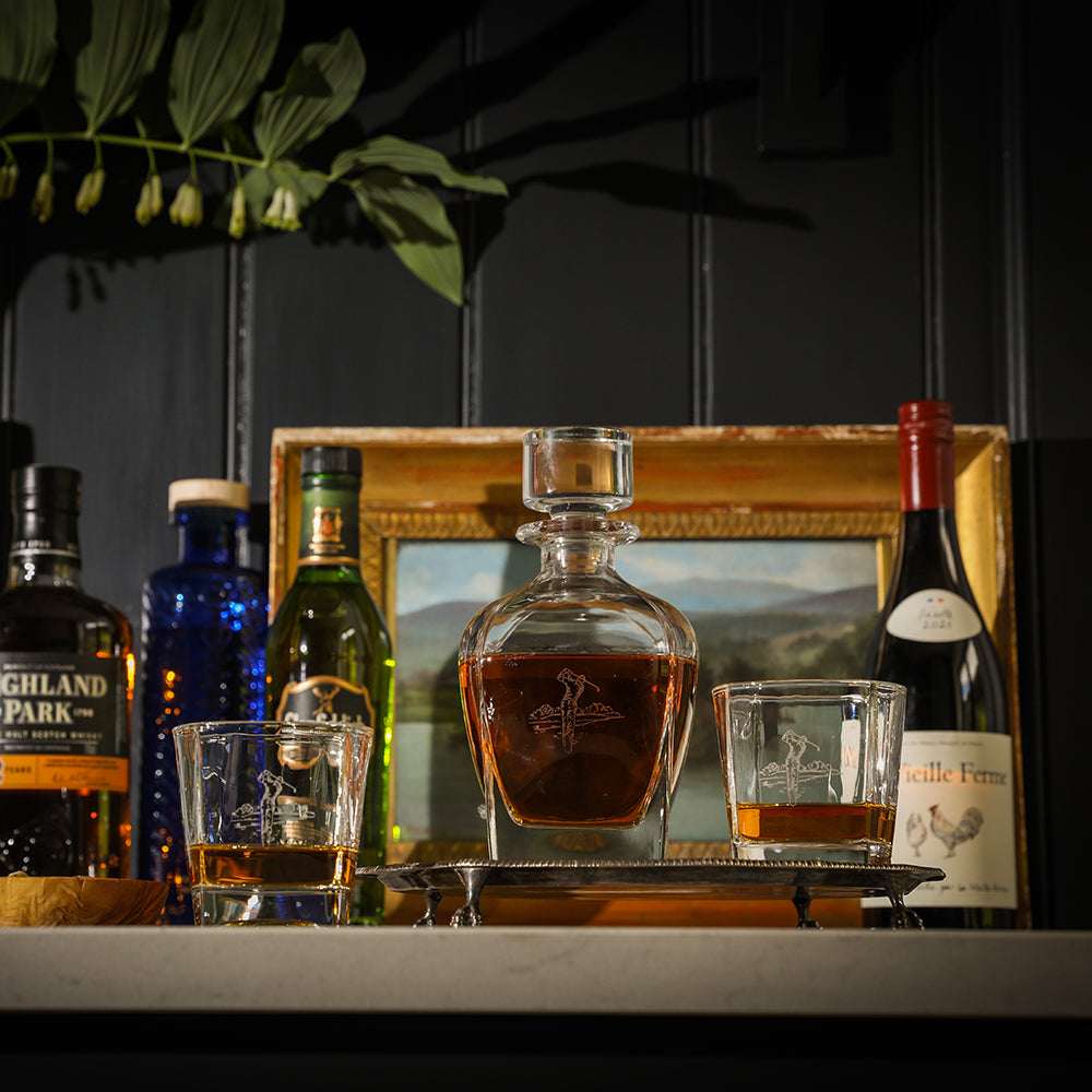 Selbrae House Golf Decanter and glass set with elegant whisky and bottles in a stylish setting