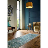 Elegant green rug with intricate patterns, perfect for enhancing modern living spaces