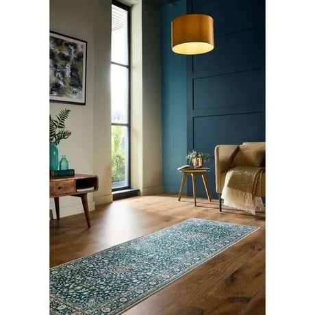 Elegant green rug with intricate patterns, perfect for enhancing modern living spaces