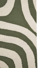 Orsina Green Throw with a stylish wave pattern for cozy home decor
