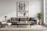 Stylish living room with a Hand Painted Canvas art piece above a grey sofa and coffee table