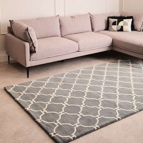 Orsina Hand Woven Rug in Grey with Geometric Pattern under a Contemporary Sofa