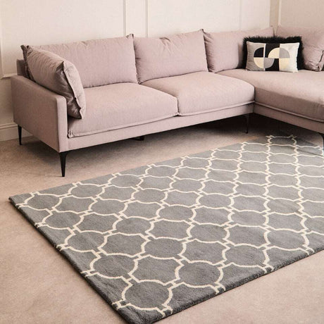 Orsina Hand Woven Rug in Grey with Geometric Pattern under a Contemporary Sofa
