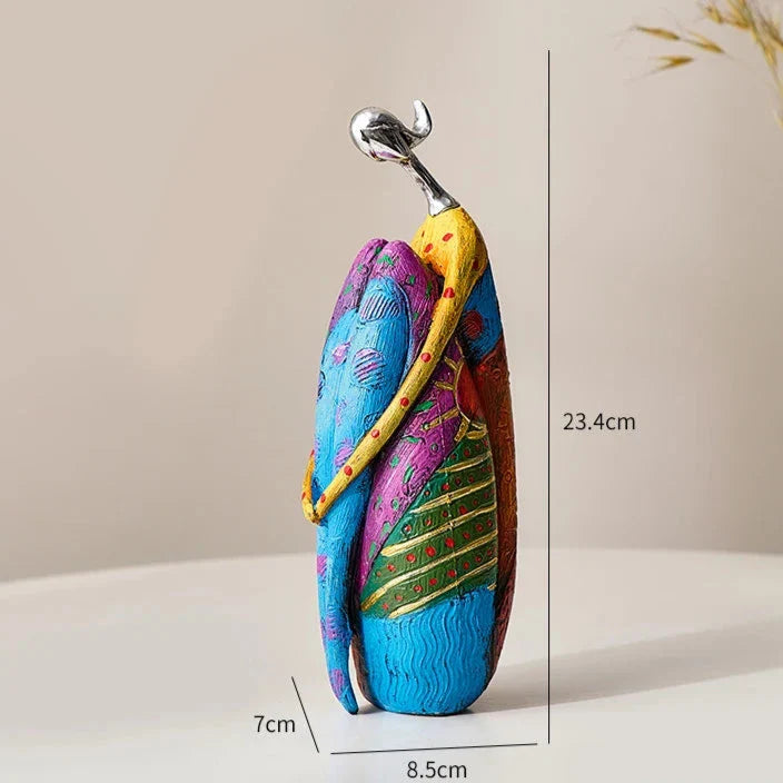 Colourful Nisu Home ornament featuring a couple in a loving embrace, perfect for home decor.
