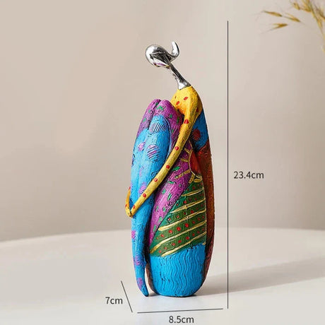 Colourful Nisu Home ornament featuring a couple in a loving embrace, perfect for home decor.