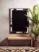 Orsina Hemp Rug in a stylish interior setting with a mirror and indoor plant