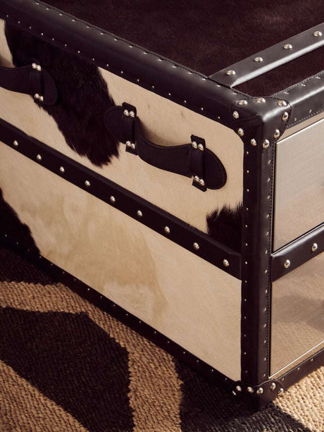 Orsina Hemp Rug displayed under a stylish trunk with cowhide accents