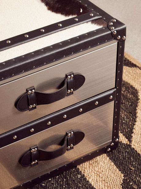 Orsina Hemp Rug featuring a stylish pattern beneath a metal and leather storage chest