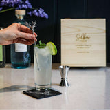 Selbrae House Highball Drinks Set with cocktail ingredients and mixing tools on a stylish countertop