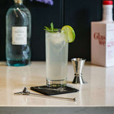 Selbrae House Highball Drinks Set featuring a cocktail with lime and mint on a marble countertop
