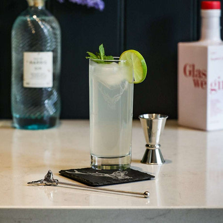 Selbrae House Highball Drinks Set featuring a cocktail with lime and mint on a marble countertop