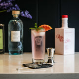 Elegant Highball Drinks Set with a refreshing cocktail and stylish glassware on a marble countertop