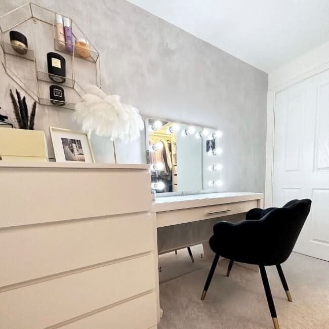 Stylish Hollywood Mirror with LED Lights above a modern dressing table and black chair