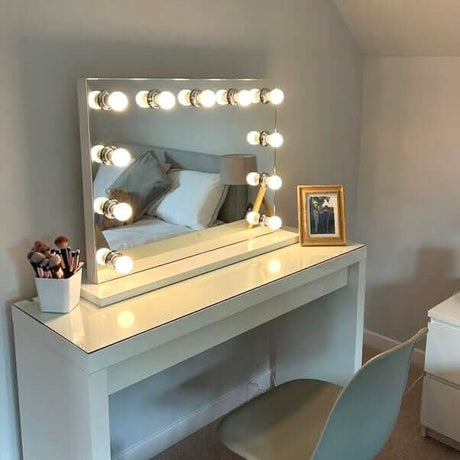 Hollywood Mirror with Bright Bulbs on a Dressing Table for Glamorous Makeup Application