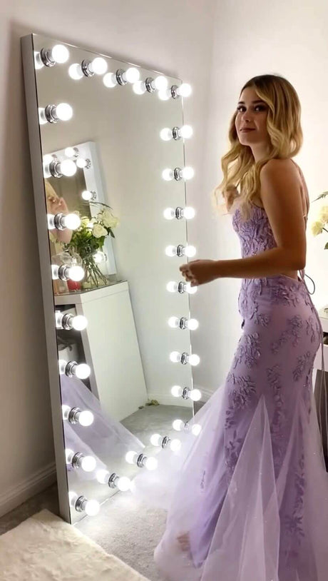 Elegant Hollywood Mirror with Bright Bulbs and a Model in a Lavender Gown for Glamorous Reflections