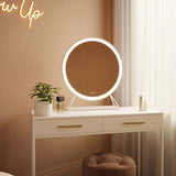 Modern Hollywood Mirror with LED lights on elegant vanity table for stylish makeup application