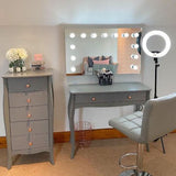 Hollywood Mirror elegantly displayed above a stylish makeup vanity with a modern chair and bright lighting