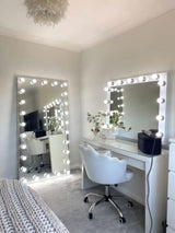 Two Full Length Hollywood Mirrors with Bright Bulbs, enhancing a stylish dressing area