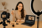 Content creator using Hollywood Mirror with makeup products at a video recording session