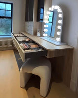 Elegant Hollywood Mirror with LED lights set above a stylish makeup vanity with drawers