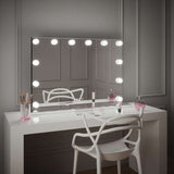 Stylish Hollywood Mirror with Bright Bulbs on Elegant Dressing Table for Glamorous Makeup Application