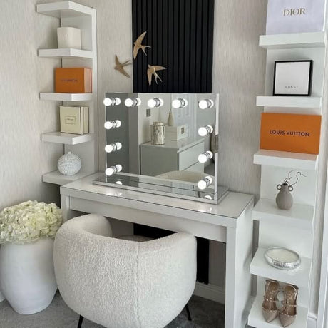 Elegant Hollywood Mirror with Bright Bulbs on White Vanity Table in Modern Makeup Room