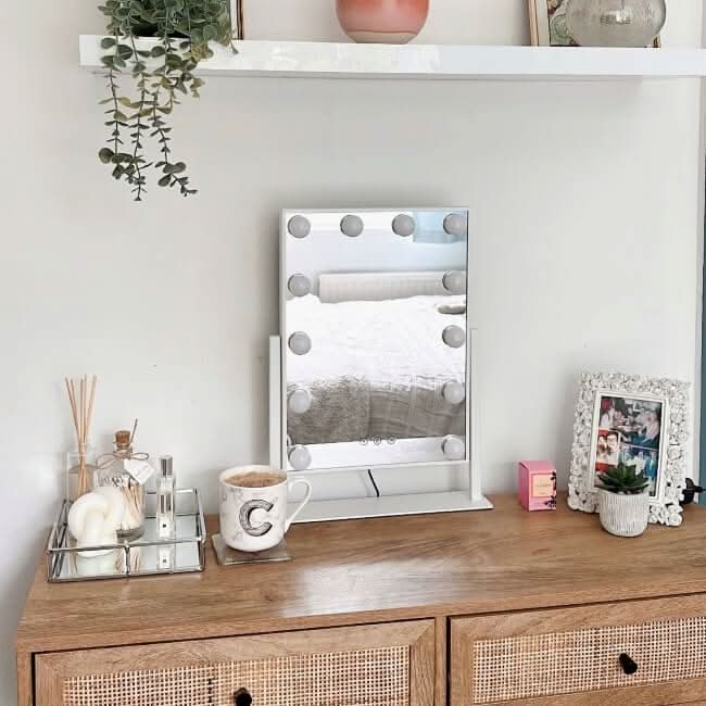 Small Hollywood Mirror with Bright Bulbs on a Dressing Table for Elegant Makeup Application