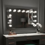 Spacious Hollywood Mirror with Bright Bulbs, Complementing Stylish Vanity and Modern Decor