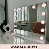 Stylish Hollywood Mirror with warm lights and sleek design, perfect for makeup and grooming