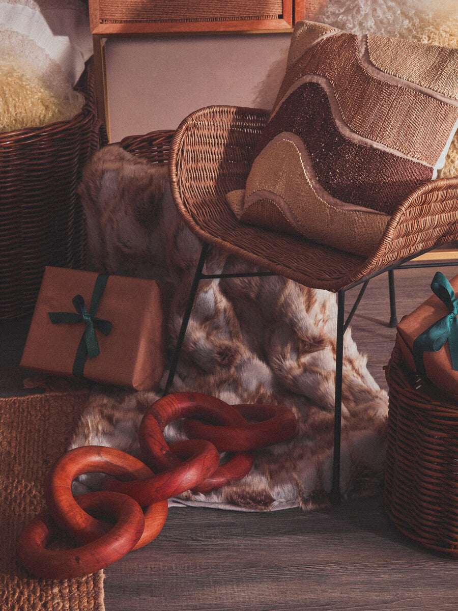 Orsina luxurious Fur Throw draped on a chair, enhancing cozy home decor with texture