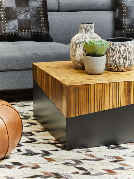 Stylish living room with a Patchwork Cushion placed on a grey sofa and decorative vases on a wooden coffee table