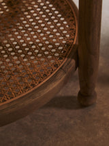 Orsina side table with natural wood finish and woven rattan top, perfect for living spaces