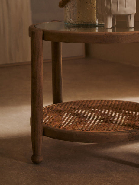 Orsina Side Table with Wooden Frame and Glass Top featuring a Woven Lower Shelf