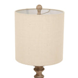 Shades 4 Seasons Table Lamp with a neutral fabric shade and a decorative base for stylish illumination
