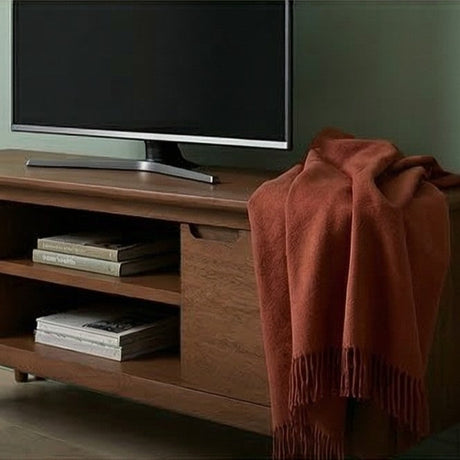 Fishe and Lilly TV Stand in a modern setting with a soft blanket draped on it