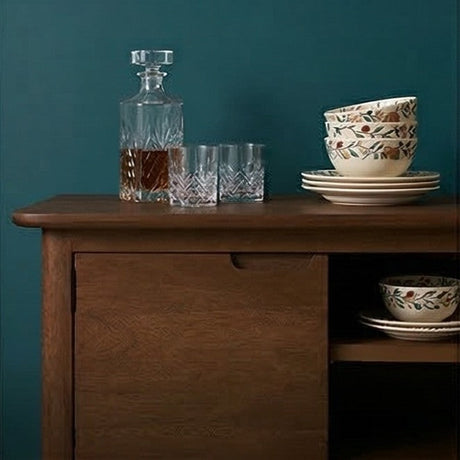 Fishe and Lilly elegant TV Stand with rich wood finish, displaying glassware and decorative bowls