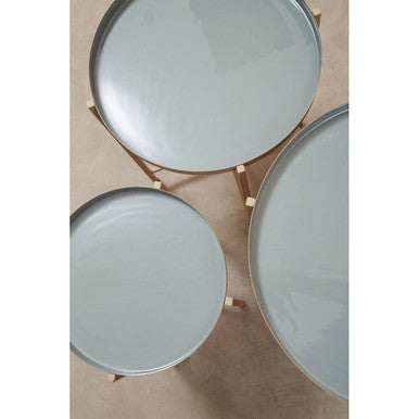 Orsina Side Tables in soft blue with sleek round designs and elegant wooden legs