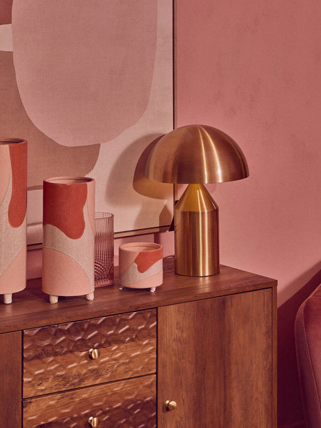 Stylish Orsina Wall Art displayed above a wooden cabinet with modern lamps and decorative vases
