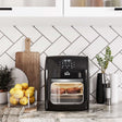 Wise Galleria Air Fryer in black showcasing evenly cooked snacks on a kitchen counter