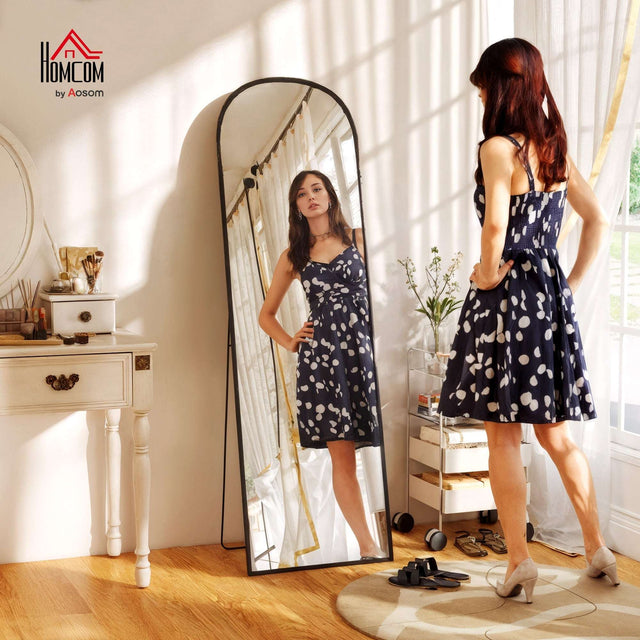 Elegant standing mirror with a sleek design, ideal for checking outfits and enhancing room decor