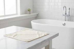 Eco Bath London Hooded Towel on a marble bathroom counter, perfect for after bath comfort